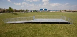 A large field with grass and a ramp.