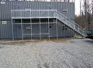 A building with stairs and steps up to it.